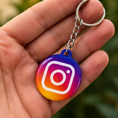 Hand holding an NFC Instagram keychain